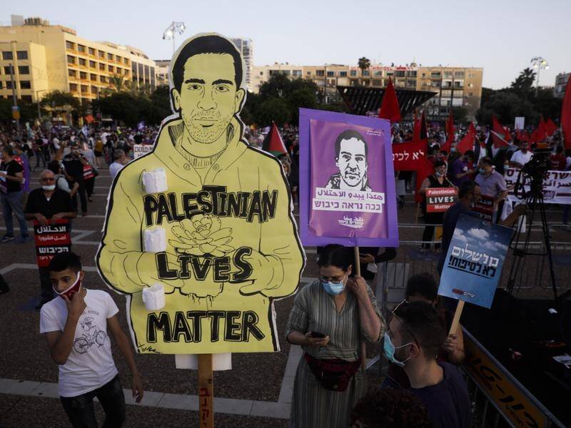 Images of autistic Palestinian Eyad Hallaq, killed by Israeli troops, at a protest in Tel Aviv.
