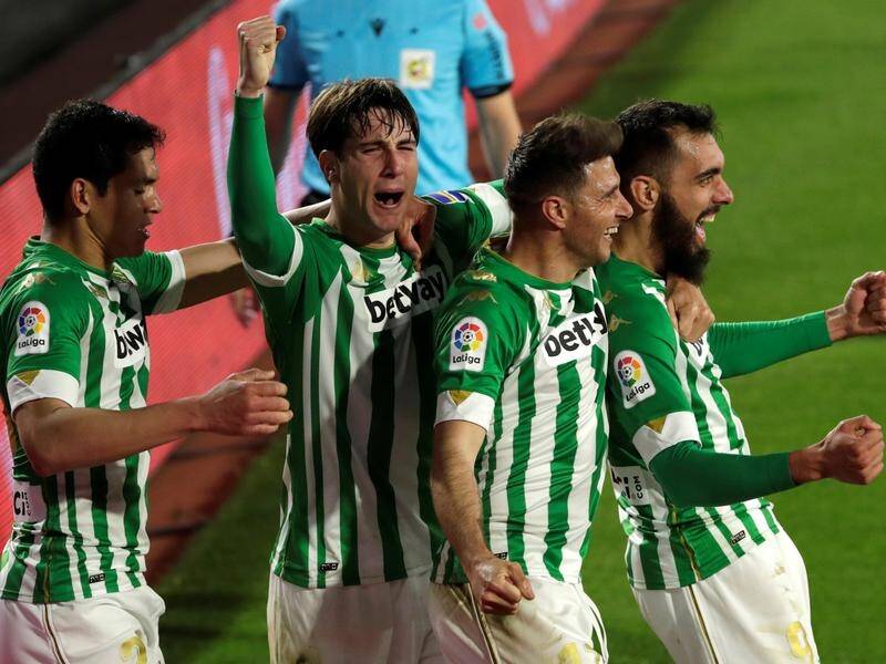 Borja Iglesias (r) celebrates scoring his second goal, and the winner, for Betis at home to Alaves.