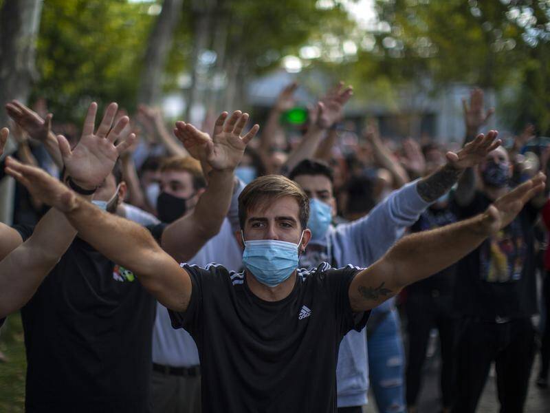 Protesters in Madrid have demanded more public health resources in the fight against coronavirus.