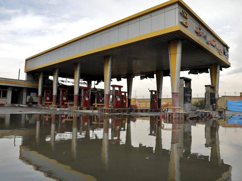 Service stations and banks were seriously damaged during the unrest in Iran over petrol price hikes.