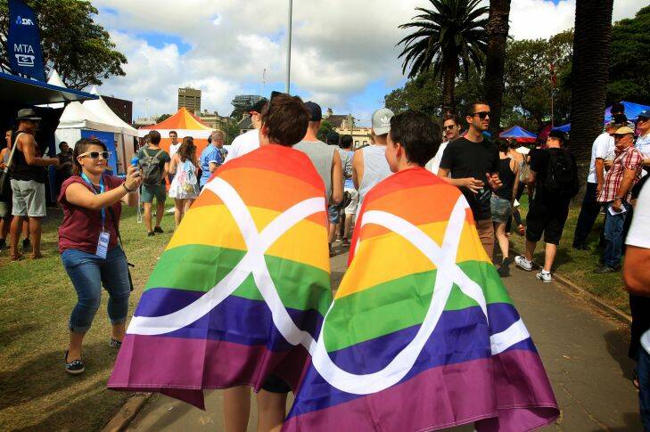 SYDNEY, AUSTRALIA - FEBRUARY 22:  Draped in the rainbow flag and enjoying the atmosphere at the Mardi Gras fair day on February 22, 2015 in Sydney, Australia.  (Photo by James Alcock/Fairfax Media)