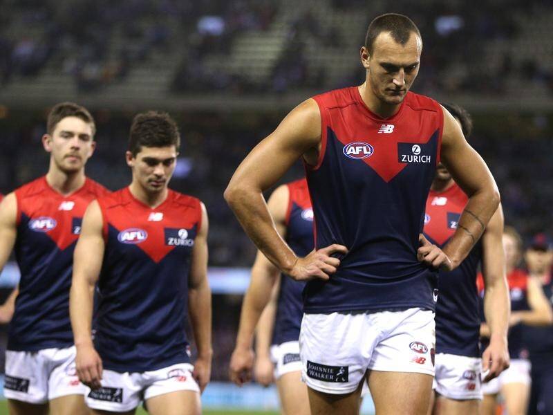 Melbourne Demons looking dejected after another loss in what has been a poor season.