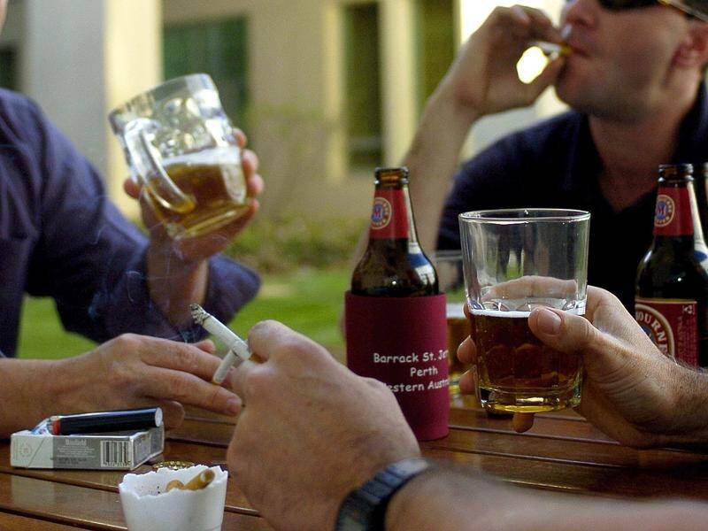 Known risk behaviours such as smoking and drinking contributed to almost half of 2019 cancer deaths. (Alan Porritt/AAP PHOTOS)