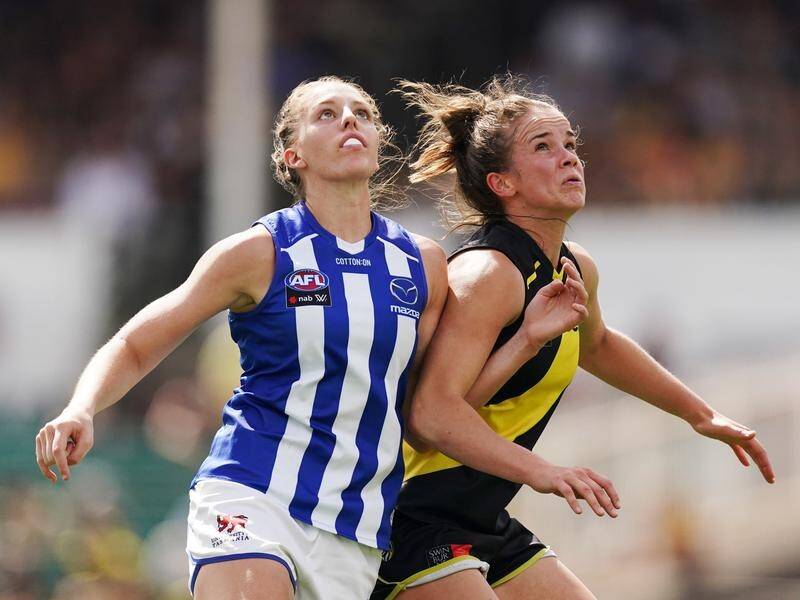 Emma King (l) put in a dominant display as North Melbourne beat Richmond by 35 points in the AFLW.