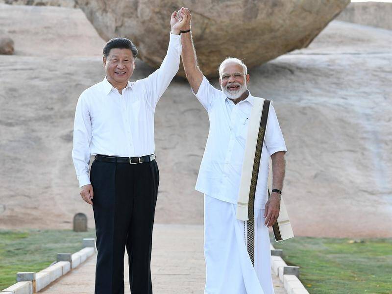 Chinese President Xi Jinping and Indian PM Narendra Modi (R) are holding a bilateral summit.