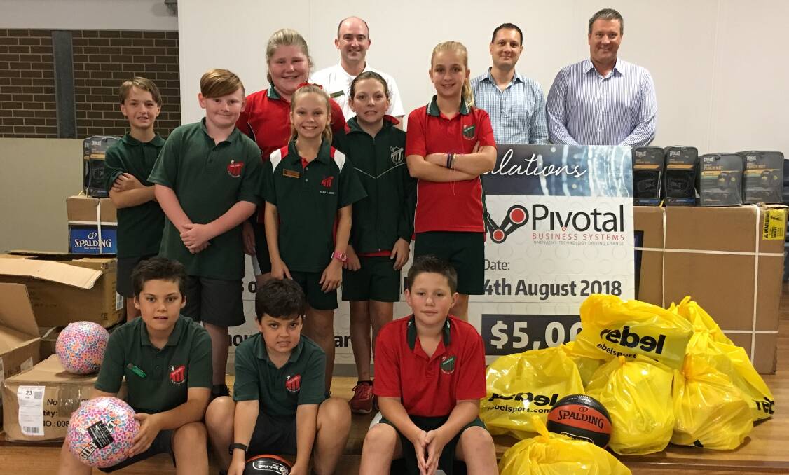 WIN: Nulkaba's Pivotal Cup team with teacher Adam Melmeth, Pivotal Business Systems manager Cory Sciulli and Newcastle Basketball general manager Neil Goffet.