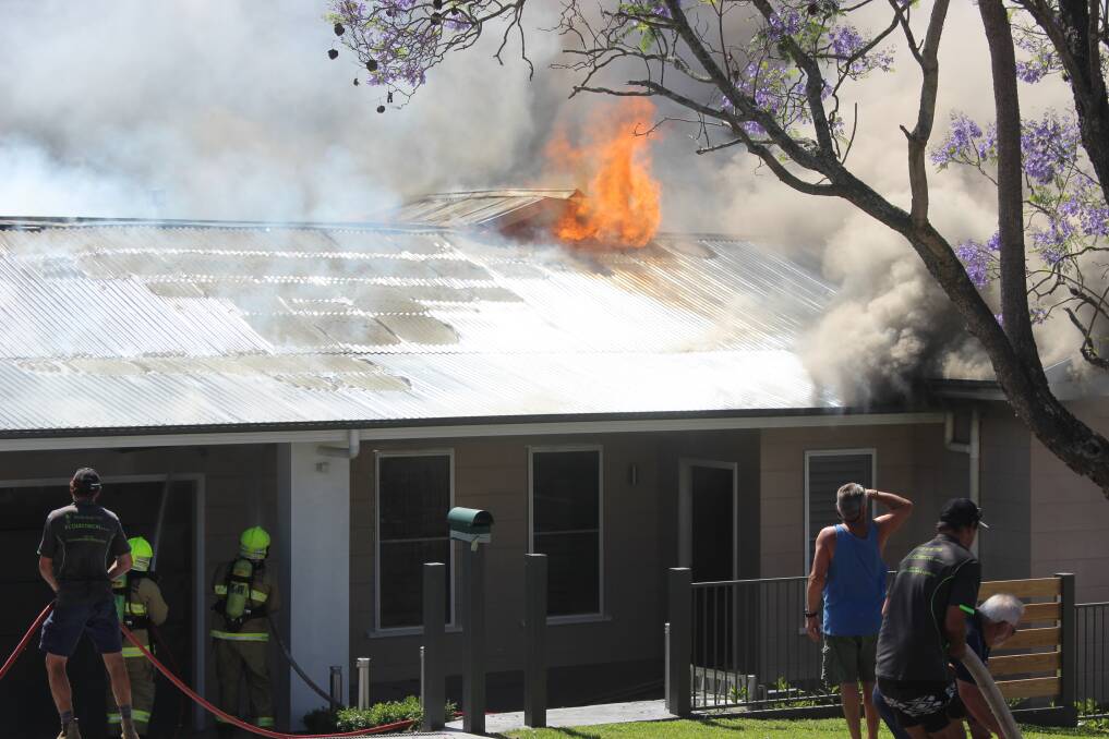 Fire threatened a house in King Street, Cessnock on Monday