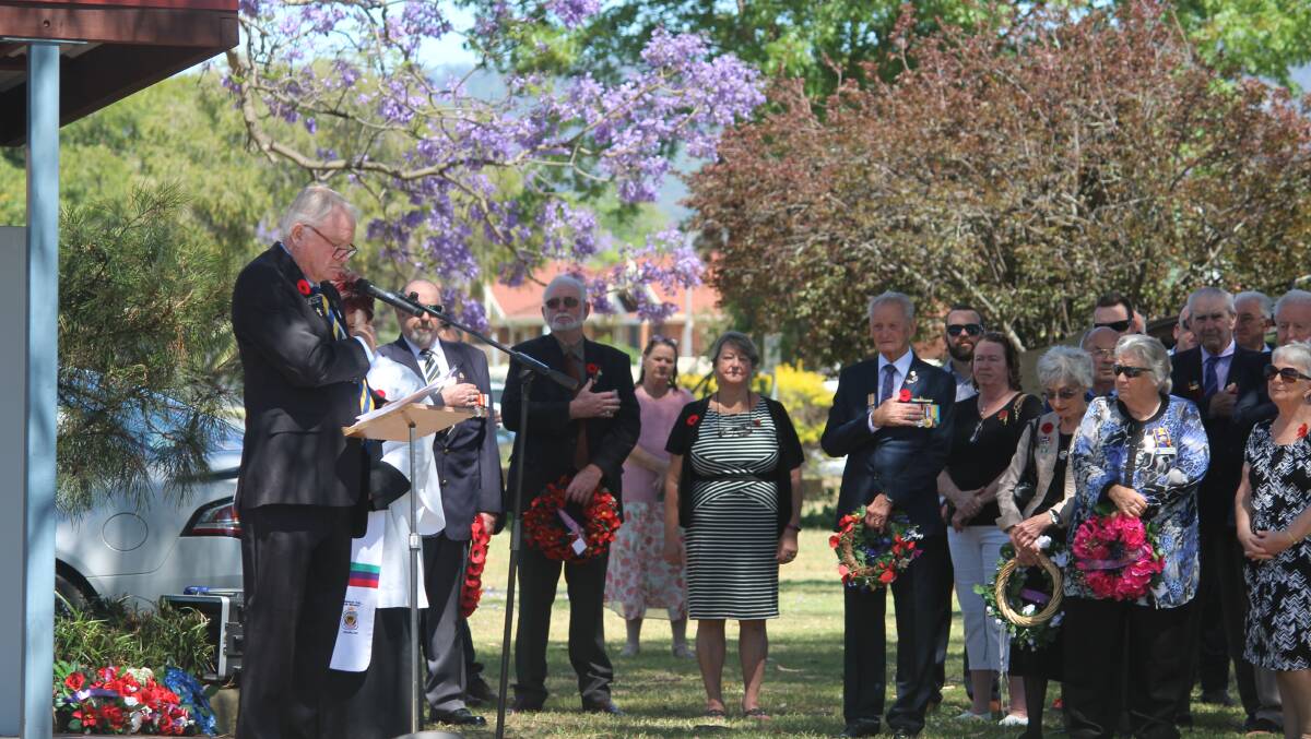 SOLEMN: Cessnock RSL Sub Branch President Max Lewis addresses the crowd at the Cessnock War Memorial on Sunday.