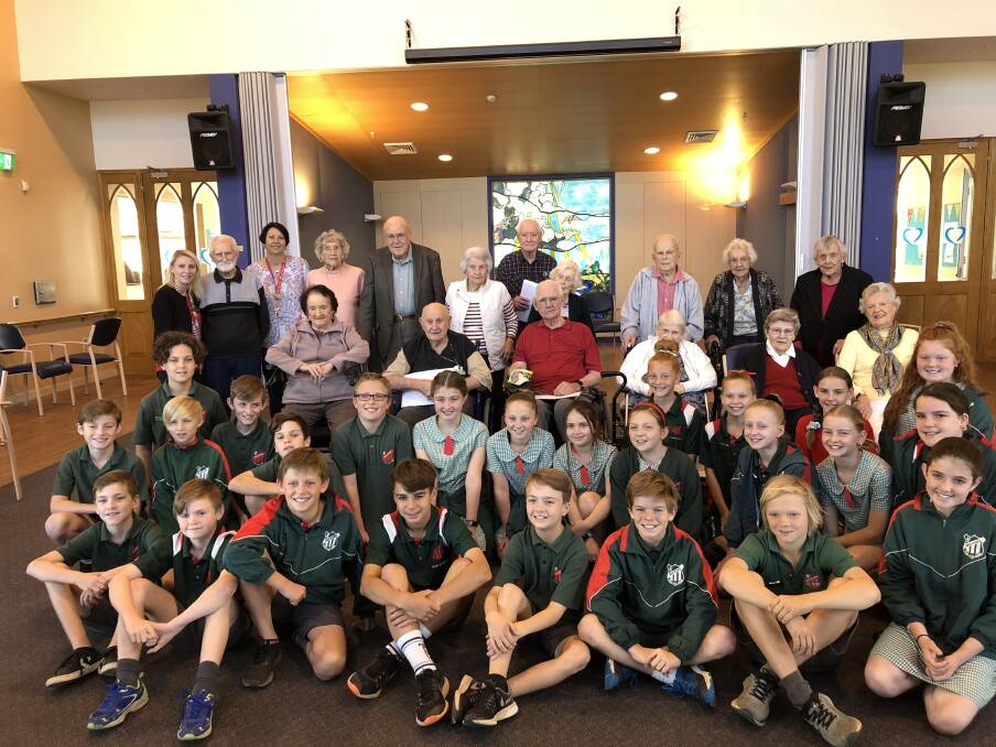 HEARTWARMING: Students from Nulkaba Public School with residents from Calvary Retirement Village.