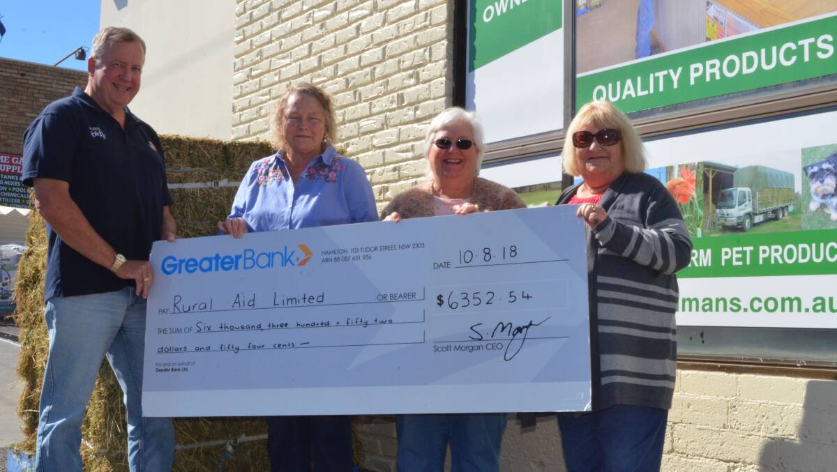 GENEROUS: Rural Aid counsellor Gary Bentley receiving a cheque from Janelle Briggs, Jenny Irwin and Glenys Elbourne from the Bellbird Country Music Talent Quest.