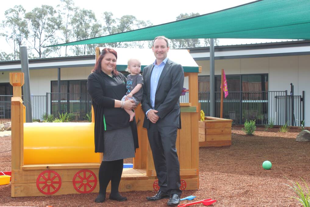 IT'S OPEN: Huntlee ELC centre director Kate Harkness and Huntlee project director Stephen Thompson with one of the centre's newest clients. Picture: Stephen Bisset