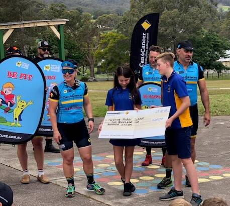 THANKS: Mulbring Public captain Lachlan Murray and leader Shaylah Tarmey receiving the $2500 cheque.