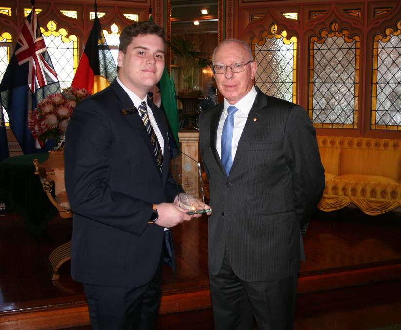 HONOUR: Cessnock High School student Kyle Gosper with Governor of NSW David Hurley. Photo: Guilio Vidoni.