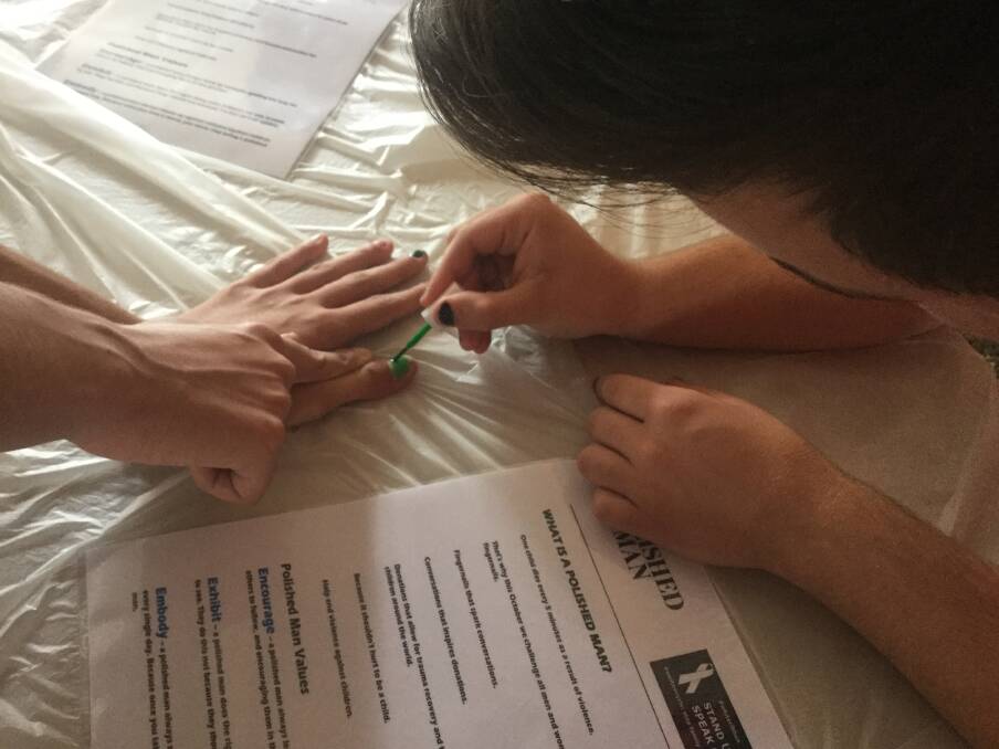 SOLIDARITY: A Mount View High student has their fingernail painted as part of the school's Polished Man initiative.