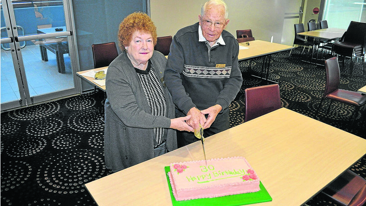 CELEBRATION: Kurri Probus Club president Marj Wotherspoon and honorary member Jack Williams cut the birthday cake.
