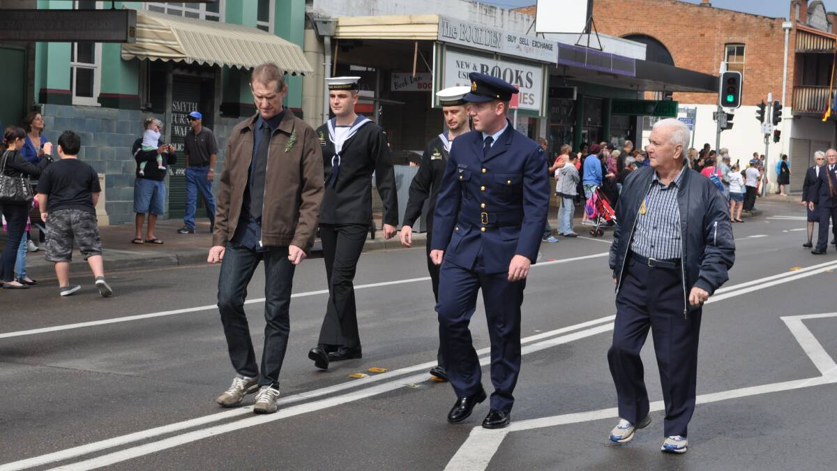 The Cessnock Anzac Day march proceeds down Vincent Street.