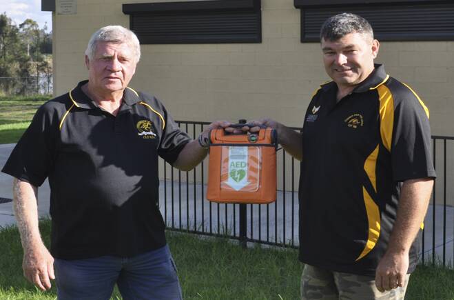 THANKFUL: Cessnock Old Boys president Glenn Goodwin presented CMRL president Stephen Mitchell with a defibrillator. 