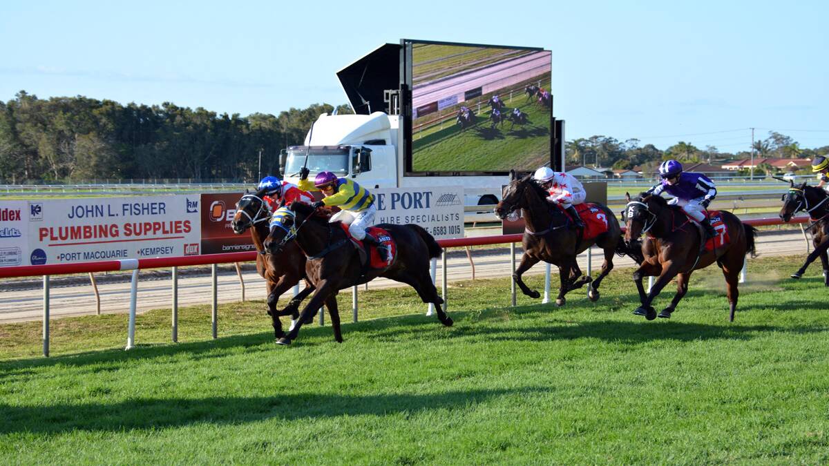 CUP WIN: Robert Thompson rides World Wide to victory in the Port Macquarie Cup on Friday. Photo by Peter Gleeson/Port Macquarie News.