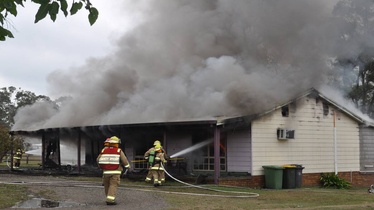 GUTTED: Fire crews work to extinguish the blaze at the Connolley family home last Tuesday.
