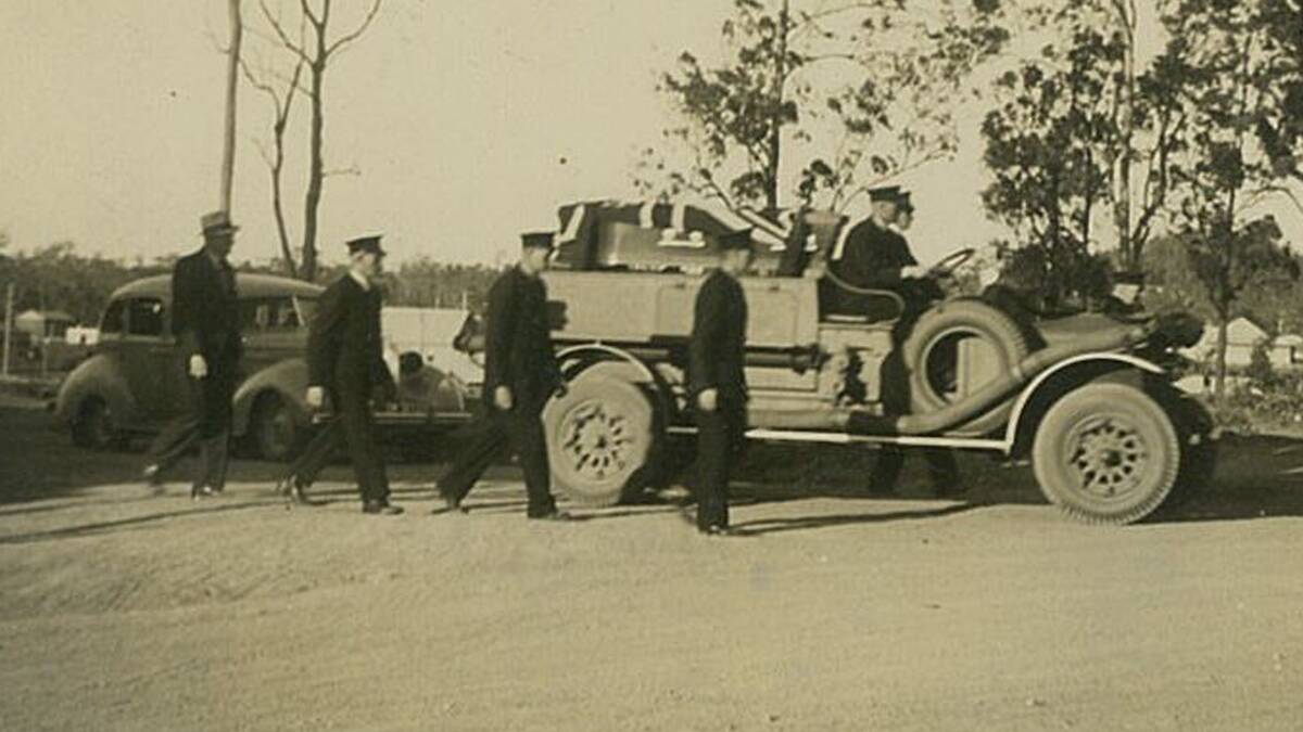 HISTORIC: Members of the Paxton Fire Brigade with the old truck in its early days.