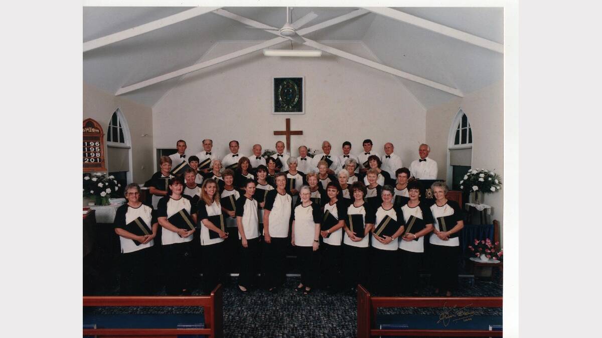 PROUD HISTORY: The Cessnock Cantata Choir, pictured at the Presbyterian Church in 1998, (back row) Ean Waters, Roy Waters, Noel Searle, Ben Orr, Cliff Williams, Clarrie Smith, Keith Wolletts, Philip Deering, Ross Smith, Alwyn Williams, Roy Avery; second row, Ilza Papworth, Julie Myers, Mary Williams, Marelle Pagan, Beryl Hudson, Noelene Skinner, Dorothy Wolletts, Noreen Orr, Val Smith; third row, Carol Shepherd, Edna Stacey, Caroline Hill, Mary Evans, Lillian Simpson, Dawn O'Conner, Shirley Hickey; front row, Mal Govey, Julie Hickey, Susan Hickey, Catherine Williams, Pam Waters, Myra Hill, Donna Rutherford, Karin Campbell, Marge Marks, Margaret Albury, Barbara Avery. Absent: Flora Hallem, Brian Hallem, Norm Maxwell.