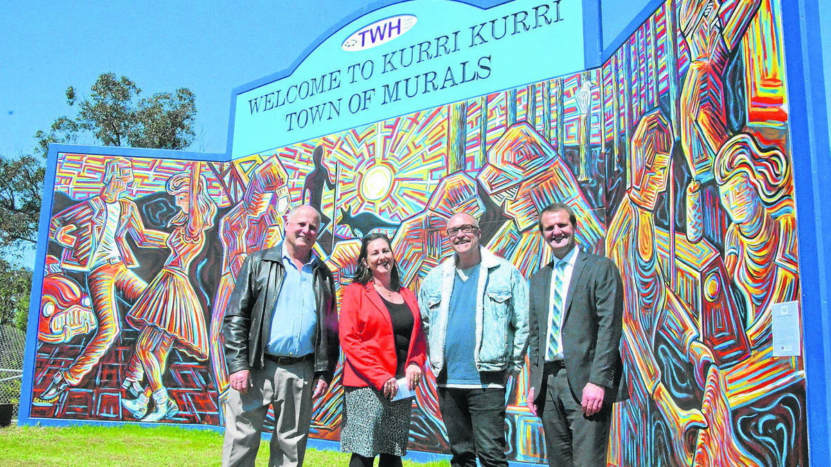 EYE-CATCHING: Towns With Heart president Toby Thomas, community projects manager Lesley Morris, mural artist Peter Sesselmann and Cessnock MP Clayton Barr at the new mural located off the Hunter Expressway’s Kurri exit ramp.
