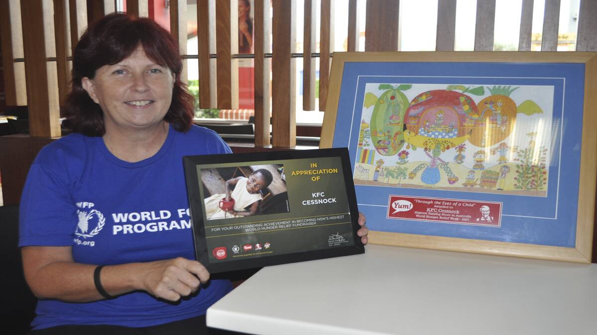 EMOTIONAL: KFC franchisee Julie Kay travelled to Laos to see how World Hunger Relief funds are being used.