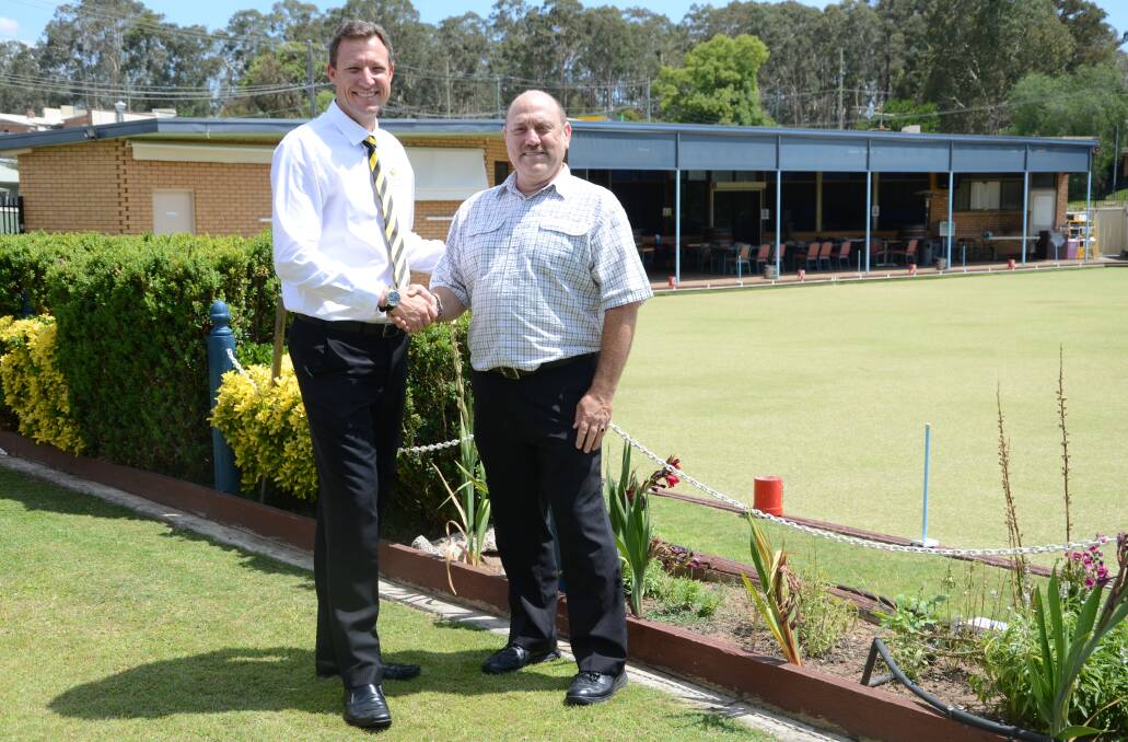 MERGER:  Cessnock Leagues Club CEO Paul Cousins and Paxton Bowling Club president Douglas Curry.   	Picture by SAGE SWINTON