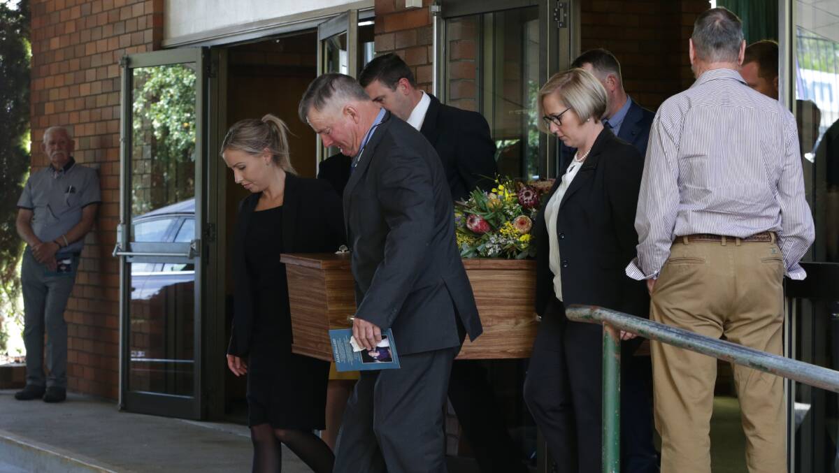 Final farewell: The end of the funeral service for Eddie Lumsden at East Maitland on Friday afternoon. Picture: Simone De Peak
