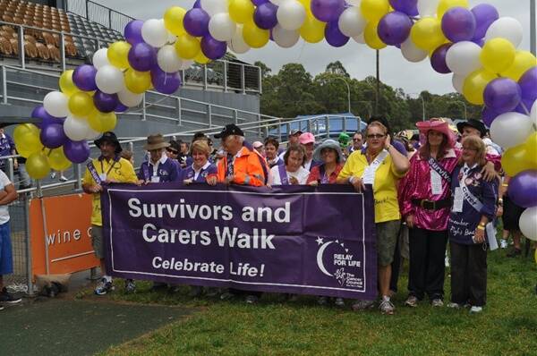 THE START: Cancer survivors and carers set off for the first lap of the 2012 Cessnock Relay For Life.