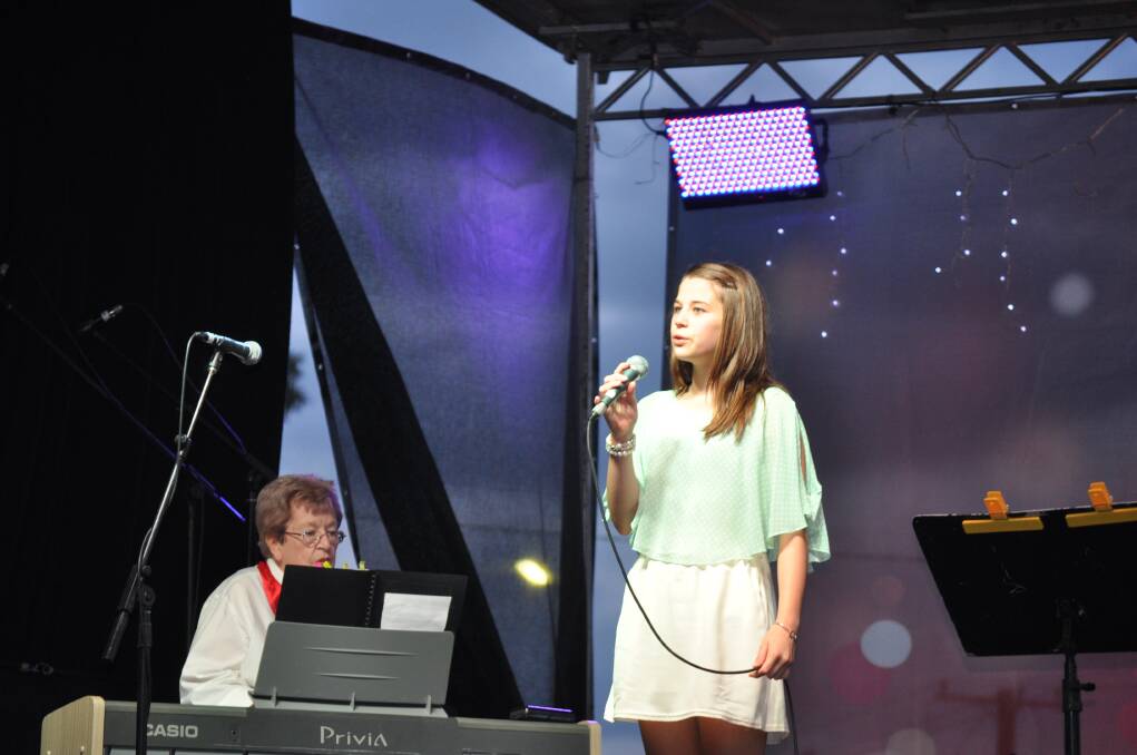 Ruby Smith sings "Joy To The World", accompanied by Anne Whale, at Carols in the Park, Cessnock TAFE grounds, December 6.