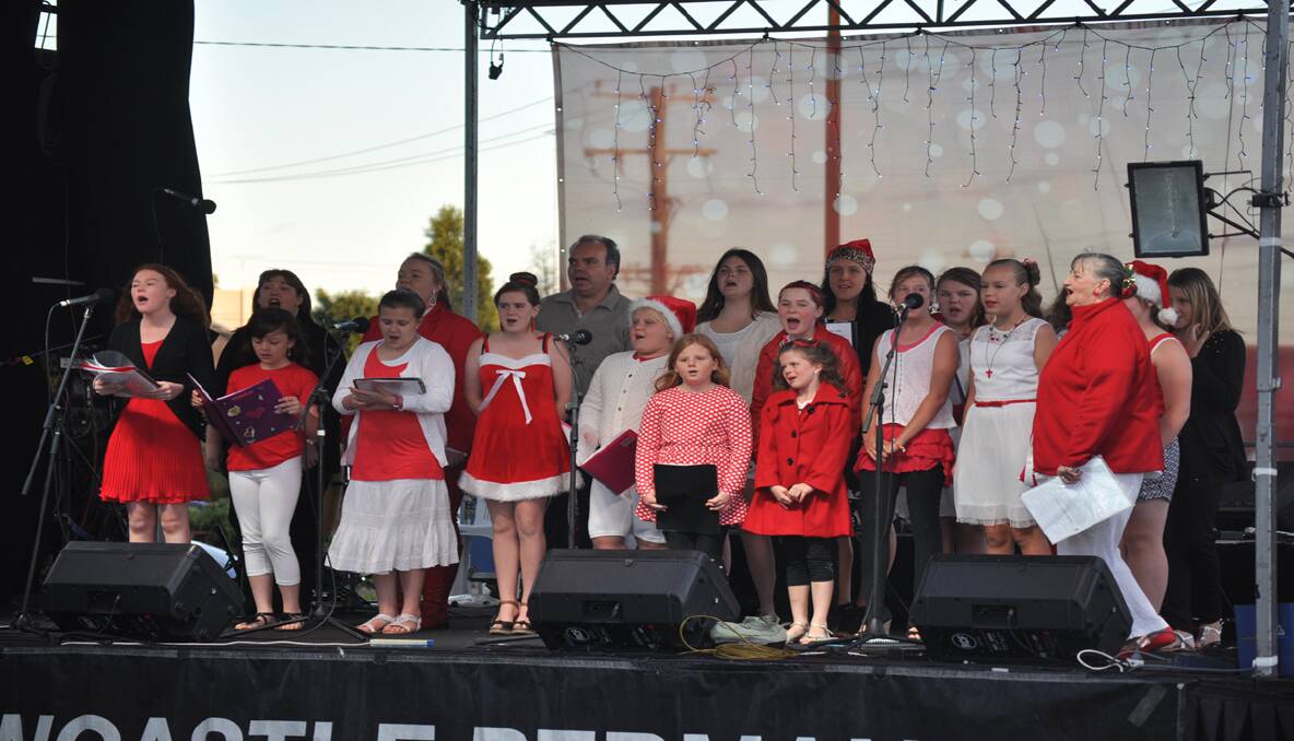 STARS: The Delma Whyte singers were the opening act to the Carols in the Park. 