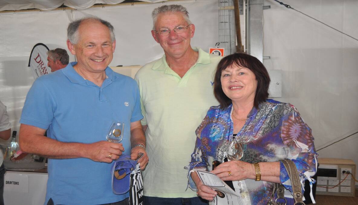 GREAT DAY: Cessnock mayor Bob Pynsent with Geoff and Julie Walker of Cessnock at the Hunter Valley Wine Festival on Saturday. 
