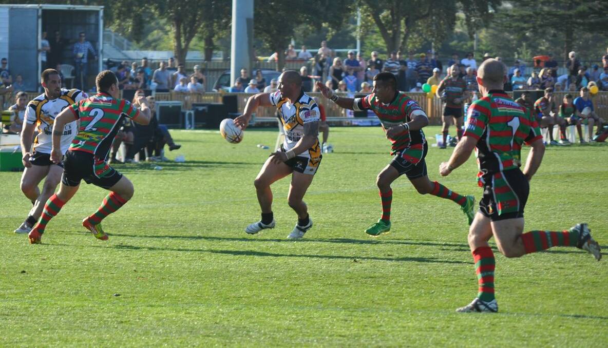 Second-half action from the Newcastle Rugby League grand final. Shaun Metcalf offloads to brother Dan.