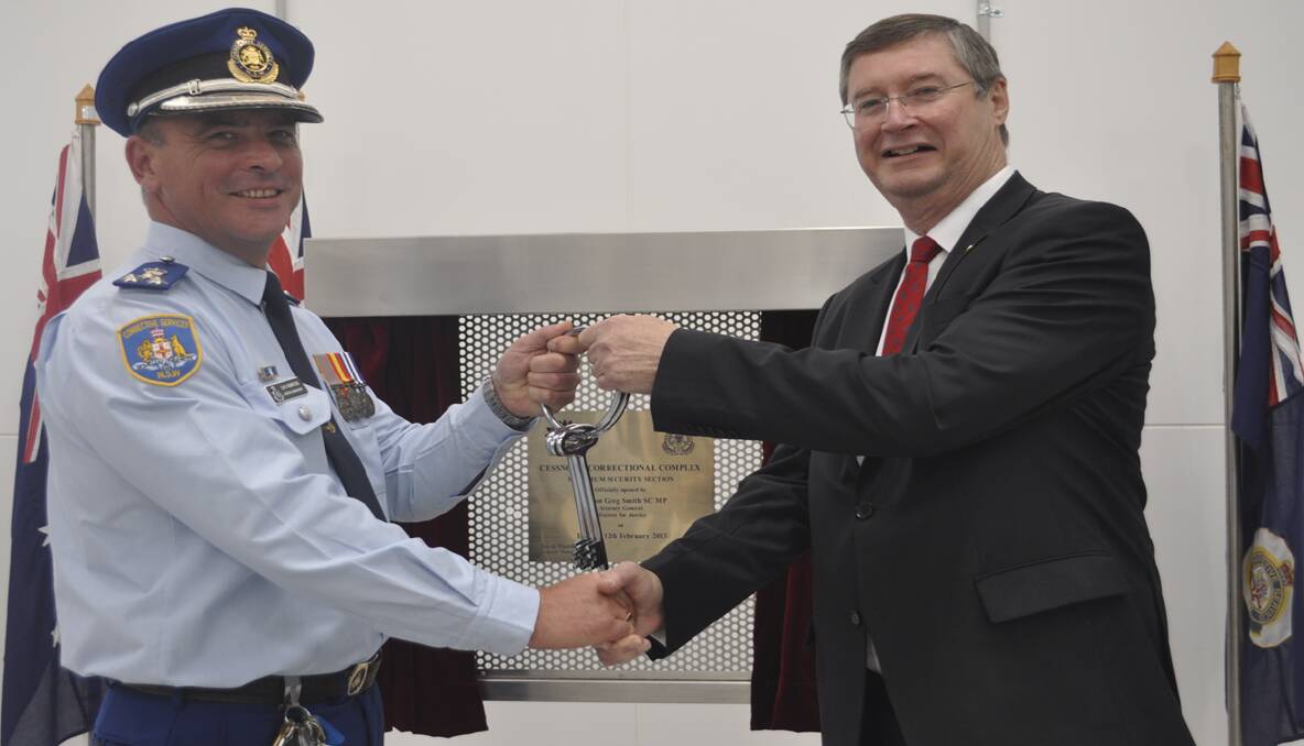 CEREMONY: Cessnock Correctional Complex General Manager David Mumford receives the keys from Attorney General and Minister for Justice Greg Smith. Photo by Jessica Willard.