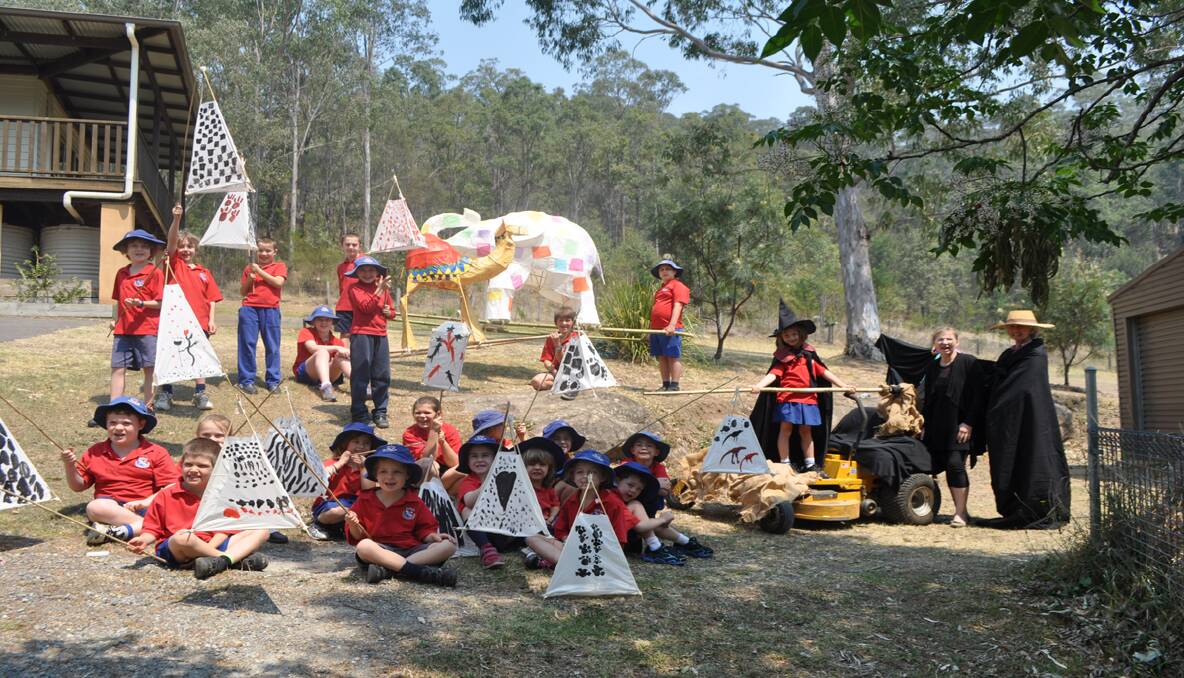 CREATIVE: Students from Laguna Public School with the lanterns they have made for the Wollombi Small Farms Fair with organiser Sally Sullivan and school principal Chris Davey, as well as a Halloween-themed mower that is taking part in the Mower Mardi Gras.
