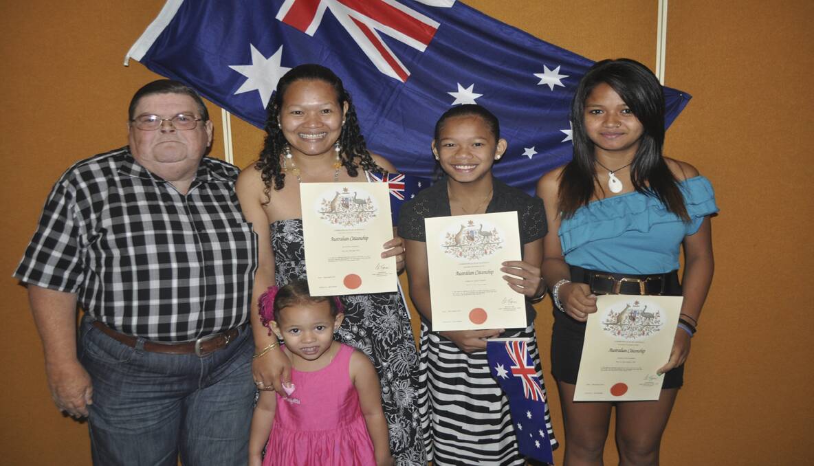  Brian and Thala Connell (front) with three of Cessnock’s newest Australian citizens, wife Marites Connell and daughters Lubelin and Mary Jane.  