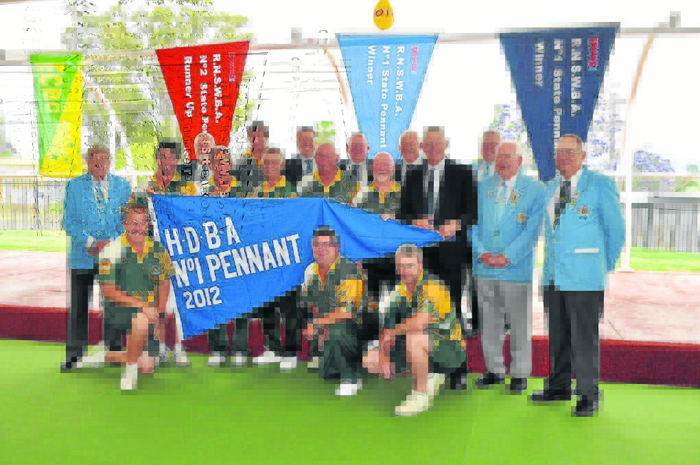 SPECIAL OCCASION: Pictured at the East Cessnock Bowling Club No. 1 Pennant unfurling and opening of the new green cover is (back row) Greg Parrey (Hunter District president), Ross Patterson, Member for Hunter Joel Fitzgibbon, Gary Jackson (ECBC club chairman), Roger Pryor (team manager), Zone 6 councillor Bruce Johnstone, (middle row) Ian McKnight (Royal NSW Bowling Association senior vice-president), Mick Cronin, Greg Burgoyne (ECBC vice-president), John Ross, Phil Cornford, Michael Parkinson, Cessnock Mayor Bob Pynsent, Ken Guy (Zone 6 president), Harold (Sam) Clough (Australian selector), and at front, John Dimopoulos, Colin Smith and Danny Mathieson. Absent: Pennant team members Tom Doig, Marc Bender and Simon Mitchell.