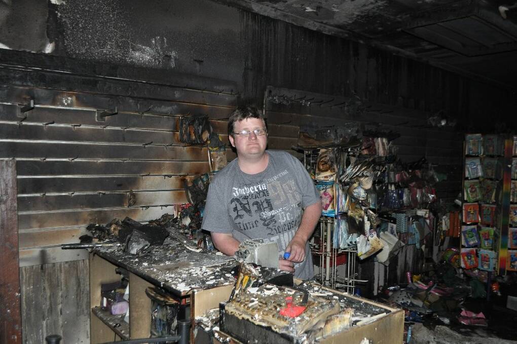 SUPPORT: Clint Ekert inside Balloon Worx that was damaged by a fire in the early hours of Sunday morning.