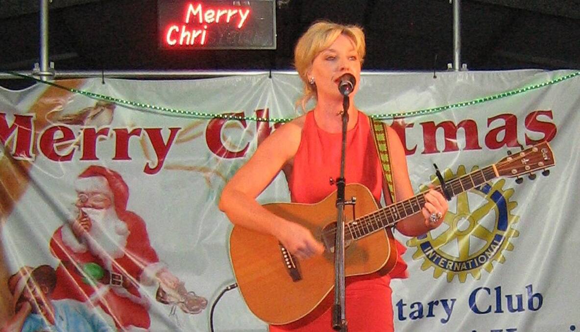 Local singer-songwriter Kristen Lane sang and compered at the Kurri Rotary Carols, Kurri Public Schools grounds, December 9.