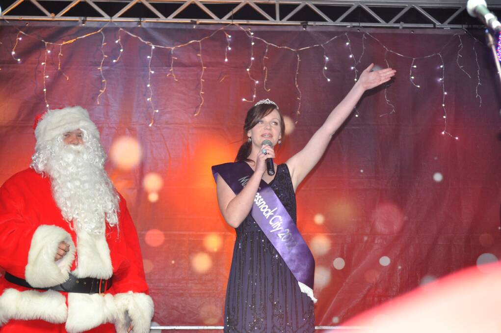 Miss Cessnock City, Taylah-Jane Turner wishes the crowd a Merry Christmas at Carols in the Park, Cessnock TAFE grounds, December 6.
