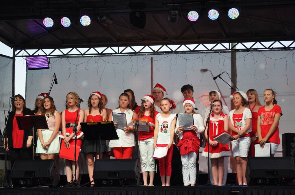 The Delma Whyte Singers opened the show with a Christmas medley at Carols in the Park, Cessnock TAFE grounds, December 6.