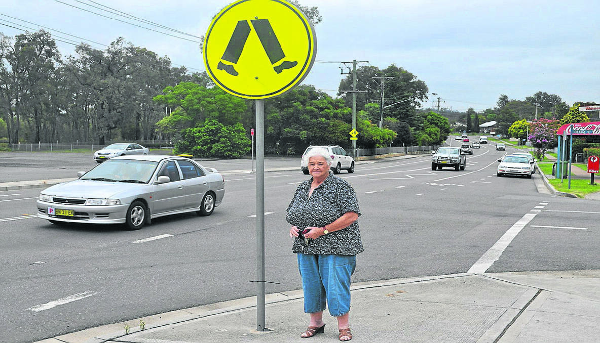 PERILOUS: Cr. Catherine Parsons at the pedestrian crossing on Cessnock Road, Abermain, where a 12-year-old girl was hit by a car late last year.