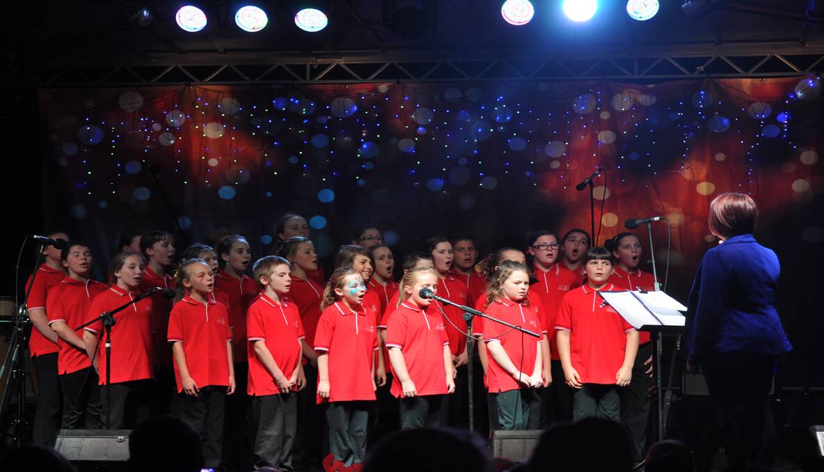 MERRY: The combined school choir led by Annie Devine, performed a traditional Carols medley. 